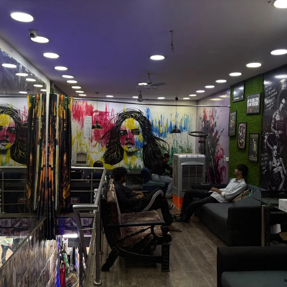 Mural wall and seating area inside Sid Ink Tattoo, Sarojini Nagar Market Delhi