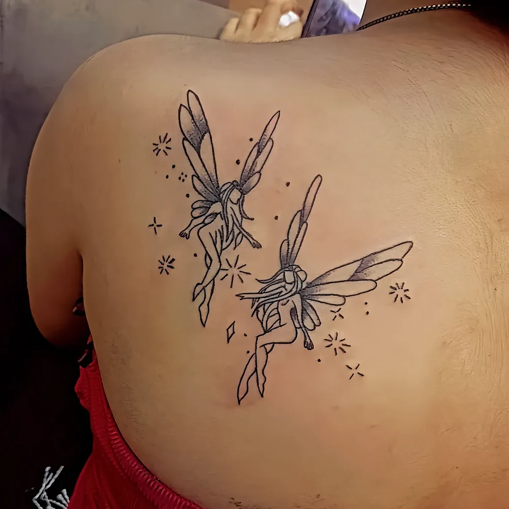 Detail of a fine line fairy tattoo by Sid Ink Tattoo Delhi